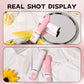 Real shot display of the white Breeze Lipstick Vibrator resting on silk fabric next to a vanity mirror.