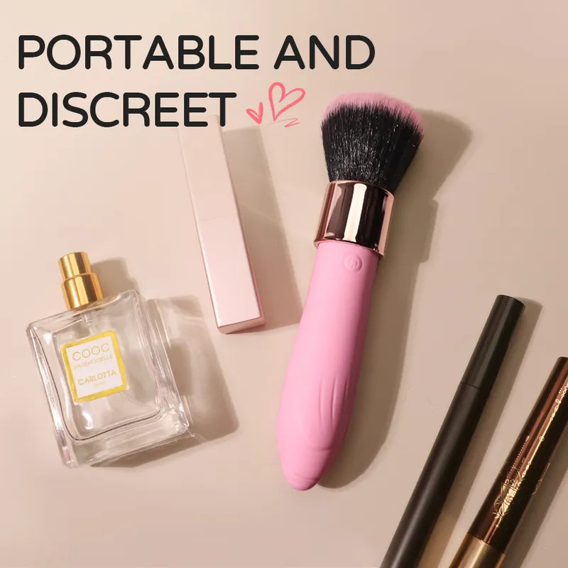 Fizzglow Caress G-Spot Vibrator displayed naturally beside perfume and cosmetic essentials for discreet vanity storage