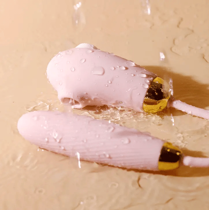 Fizzglow Dew flexible U-shaped G-spot vibrator with dual stimulation suction port and tongue licking profile in pastel pink