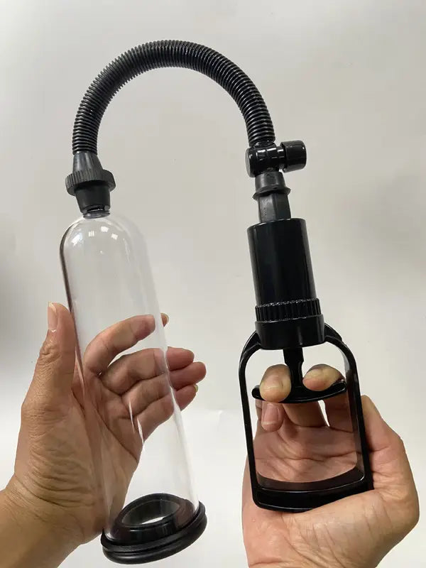Hands-on demonstration of the Fizzglow Grip Male Vacuum Trainer showing high-clarity cylinder visibility and single-handed manual trigger pump operation