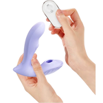 Hands holding the Fizzglow Lagoon Wearable G-Spot Vibrator alongside the compact 10-meter wireless remote control