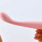 Twirl pink slim waisted g-spot vibrator with ribbed fingerprint texture showing silk soft silicone bendable body