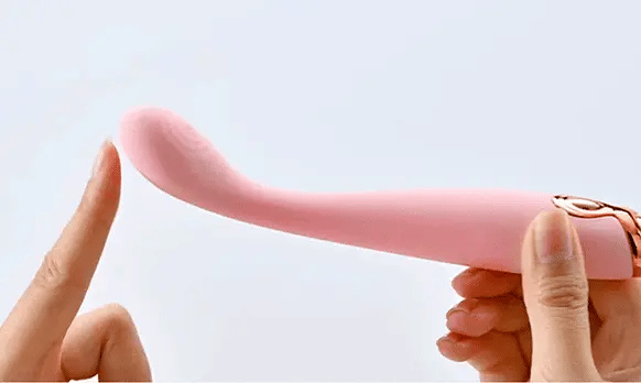 Twirl pink slim waisted g-spot vibrator with ribbed fingerprint texture showing silk soft silicone bendable body