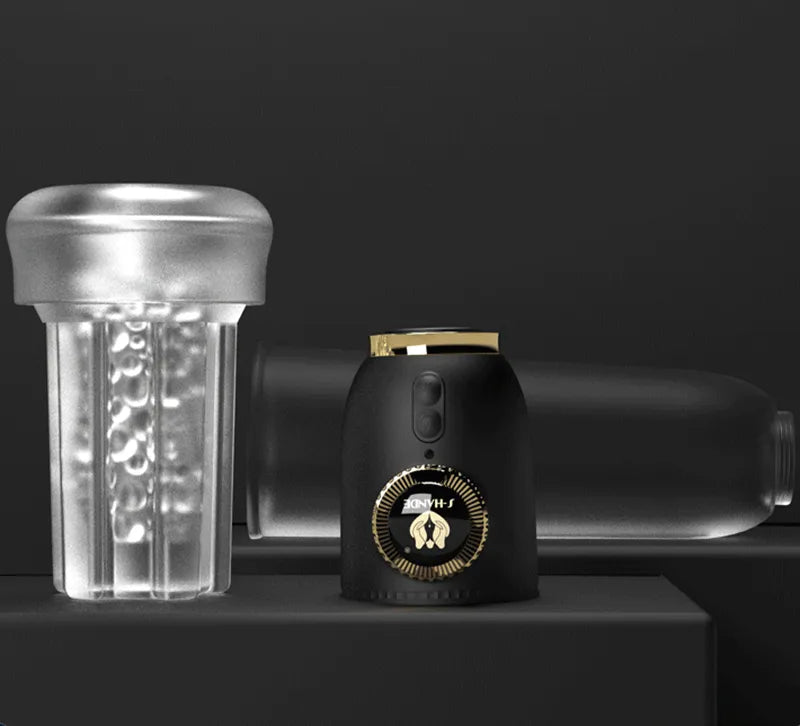 Disassembled Vault Male Penis Pump components showing transparent acrylic cylinder, black control handle with gold crown ring, and textured liquid silicone sleeve